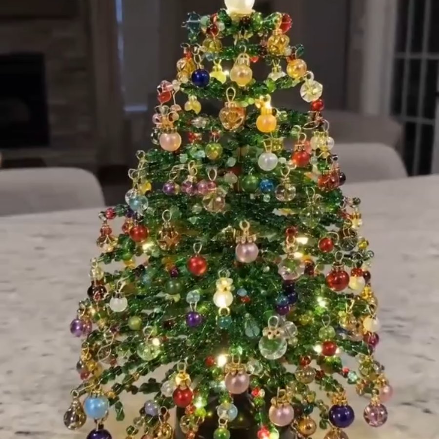 Finished beaded Christmas tree lit up
