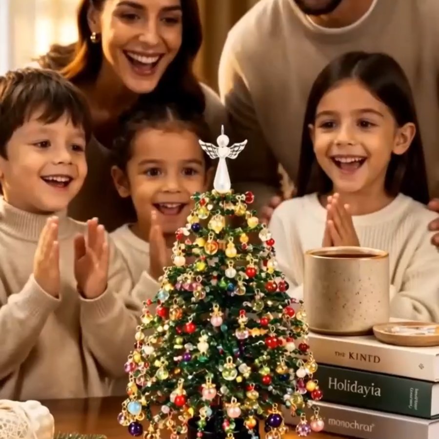 Kids clapping in front of a finished beaded Christmas tree
